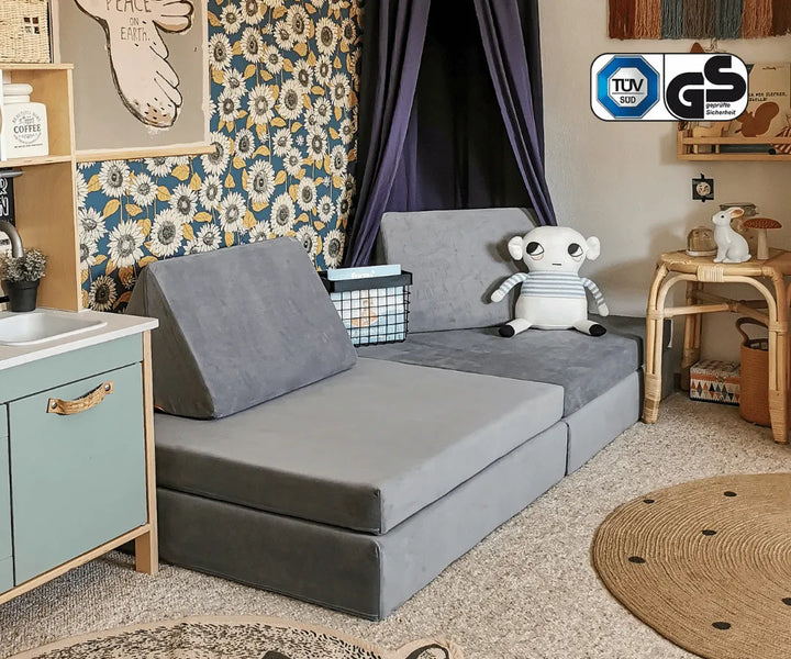 Seitenansicht eines funzy Spielsofas #farbe_mond-grau